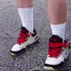 Illustration for article titled Pro-Confederate Man With KKK Tattoo Confronted for Wearing FUBU Sneakers